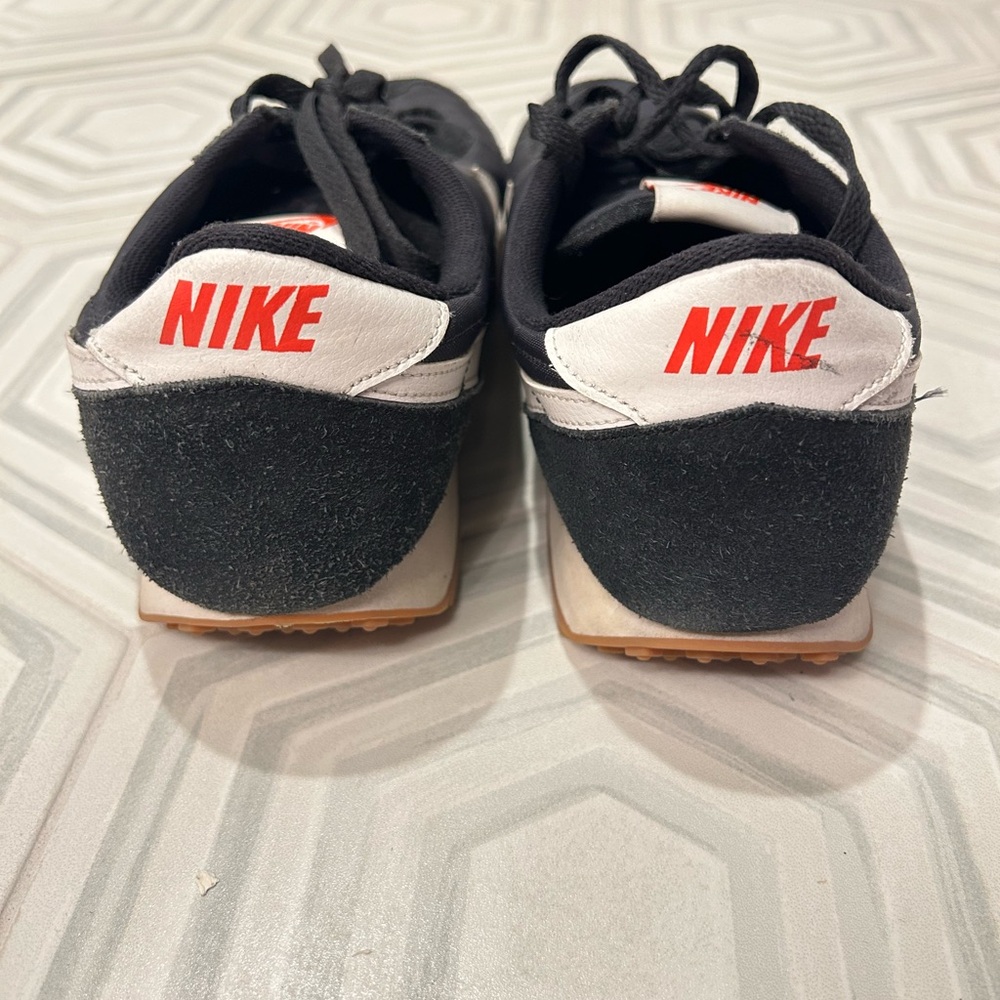 Nike Retro Black and White Sneakers with Orange Accents